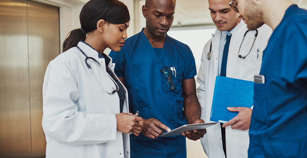 Group of doctors going over chart